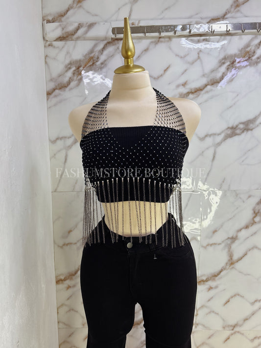 Blusa brillosa con cadena